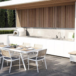 Caroma Compass Alfresco stainless steel gooseneck sink mixer in an outdoor kitchen, hob mounted on a benchtop.