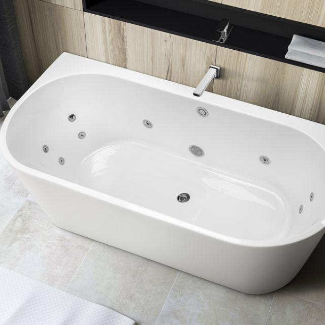 Decina Alegra white oval back-to-wall spa bath with chrome jets, shown in a modern bathroom alcove with tapware