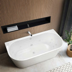 Decina Alegra white oval back-to-wall spa bath with white jets, shown in a modern bathroom setting