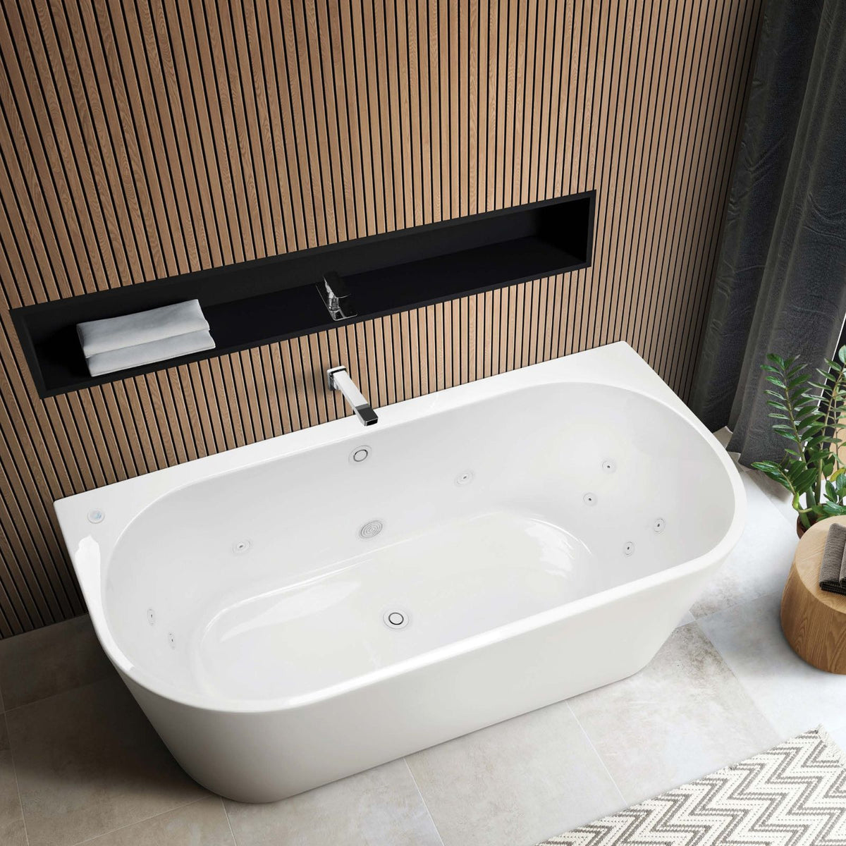 Decina white oval back-to-wall freestanding spa bath with white jets in a modern bathroom setting