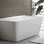 Decina Aria white back-to-wall freestanding bath in bathroom, rectangular acrylic tub with integrated overflow