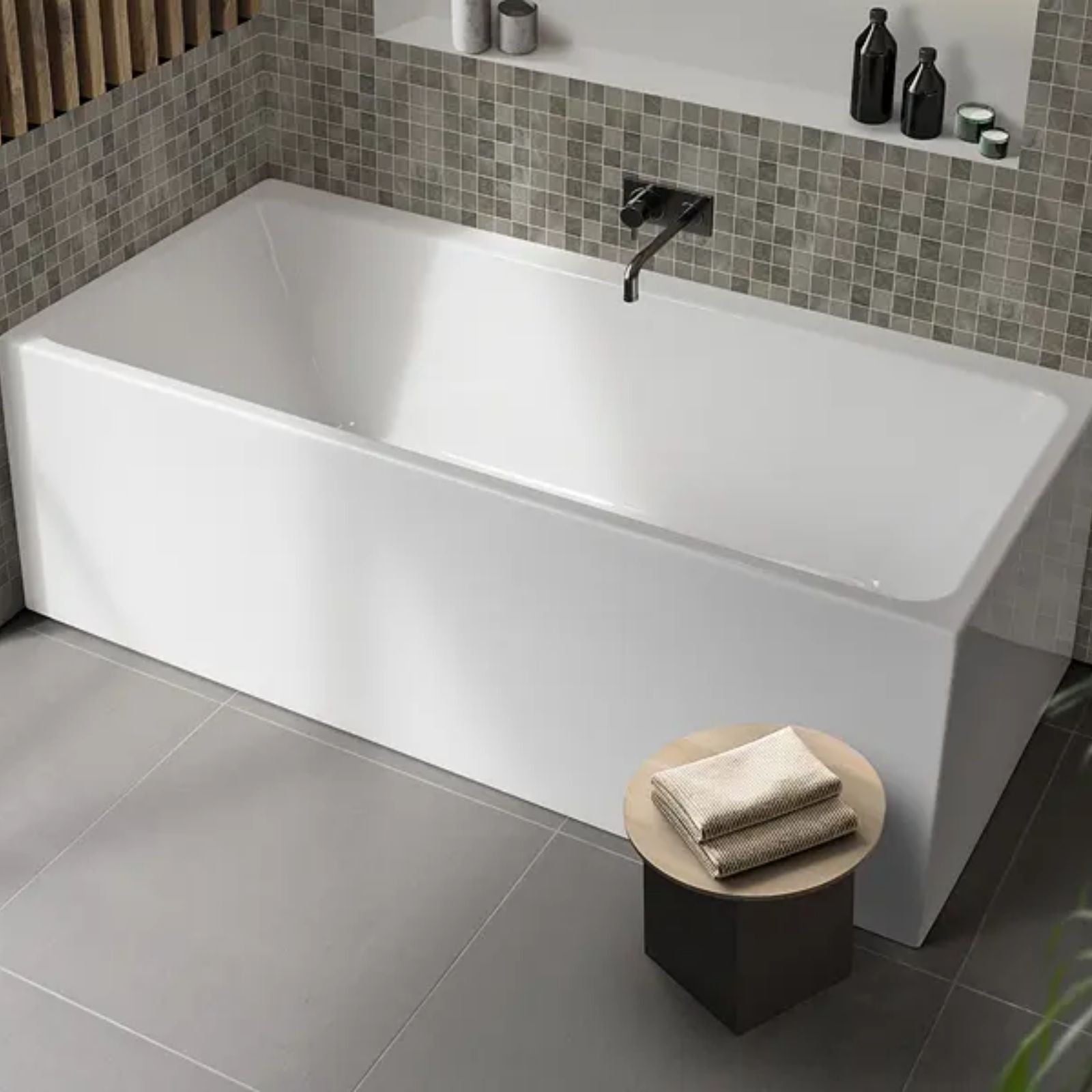 Decina Bianco white acrylic back-to-wall freestanding bath, rectangular corner installation in a modern bathroom setting