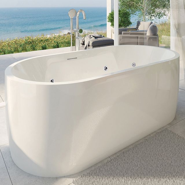 Decina Elisi freestanding oval spa bath in gloss white acrylic, shown in a coastal bathroom setting