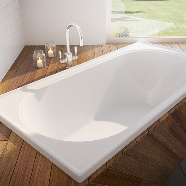 Decina Turin white inset bath with oval interior, shown installed in a tiled hob on timber flooring