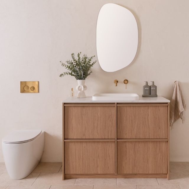 ADP Eli floor standing vanity with white Caesarstone top, natural wood finish, all-drawer design in bathroom setting