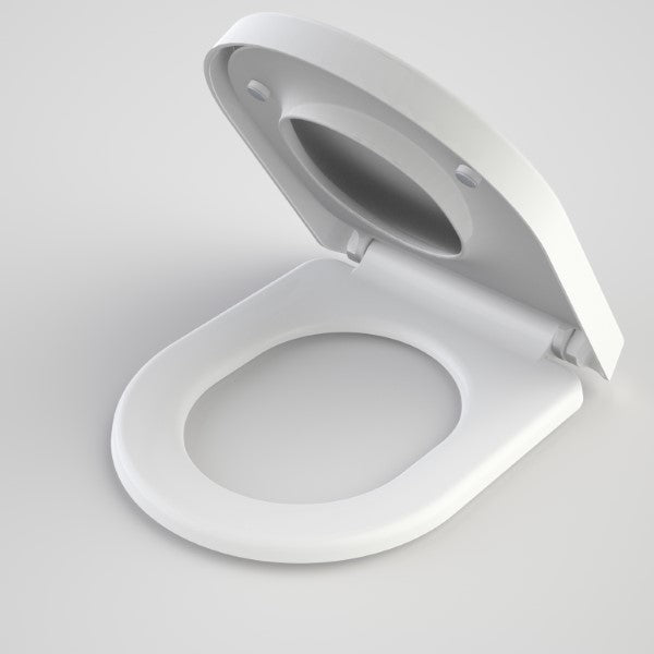 Caroma white D-shape toilet seat with integrated child seat, lid open