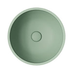 Fienza Alba round concrete above-counter basin in sage, top view, with no tap hole and centred waste opening