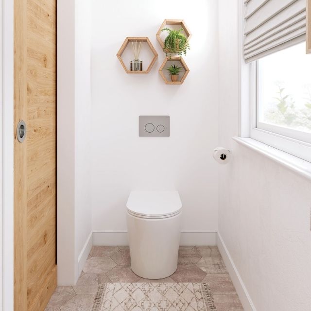 Fienza Aluca wall-faced toilet suite in gloss white, shown in a small bathroom with slim seat and concealed cistern button plate