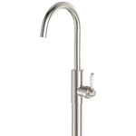 Fienza Eleanor floor mounted bath mixer in brushed nickel with curved swivel spout and white ceramic lever handle