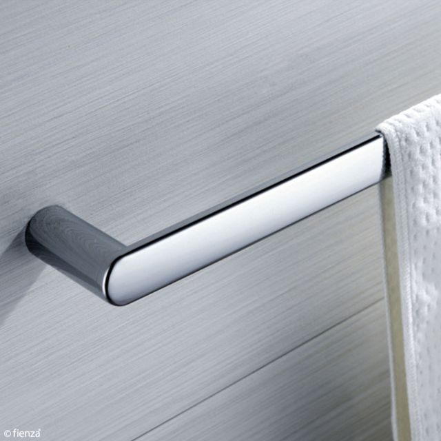 Fienza Empire chrome single towel rail mounted on a bathroom wall with towel hanging over the end
