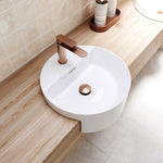 Fienza Empire Slim brushed copper basin mixer on a white round above-counter basin in a light timber vanity bathroom