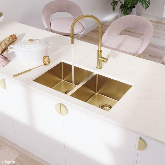 Fienza Hana double bowl kitchen sink in rugged brass, topmount in a white benchtop with matching gold tap and wastes