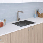 Fienza Hana stainless steel laundry sink, topmount in white benchtop with mixer tap in modern laundry scene
