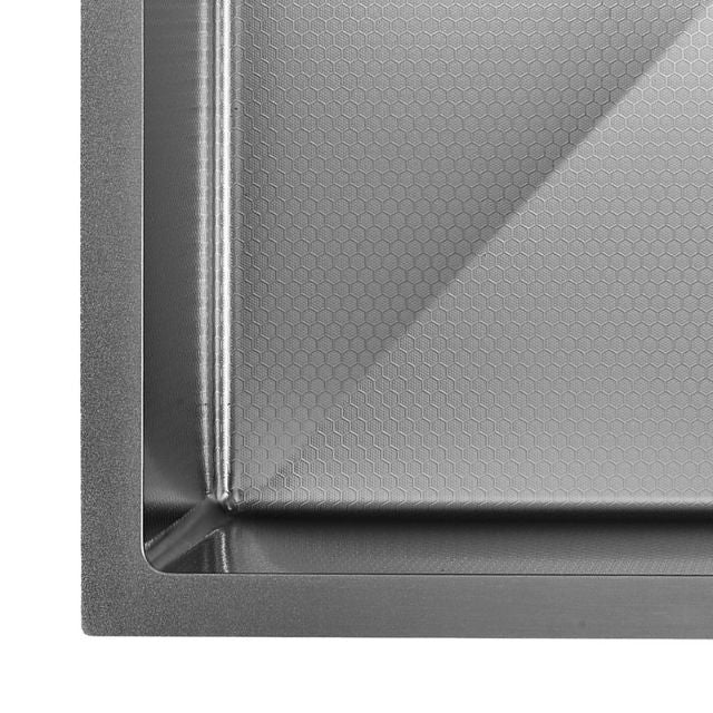Fienza Hana gun metal single bowl kitchen sink corner detail with hex pattern base and welded steel edge
