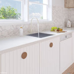 Fienza Hana stainless steel single bowl kitchen sink in white benchtop, under-mount style with mixer tap, lifestyle kitchen view
