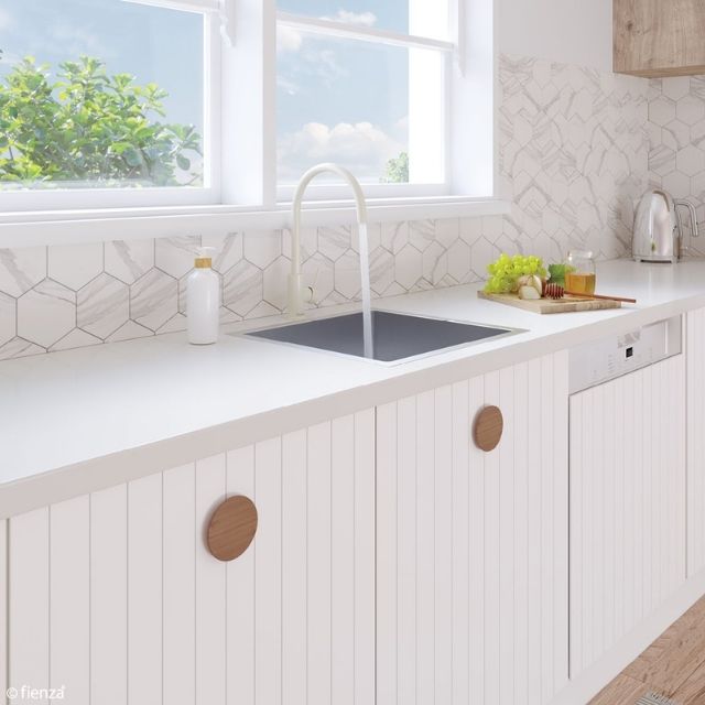 Fienza Hana stainless steel single bowl kitchen sink in white benchtop, under-mount style with mixer tap, lifestyle kitchen view