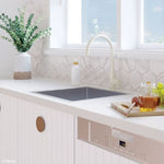 Fienza Hana single bowl stainless steel sink in white benchtop kitchen, with gooseneck mixer tap