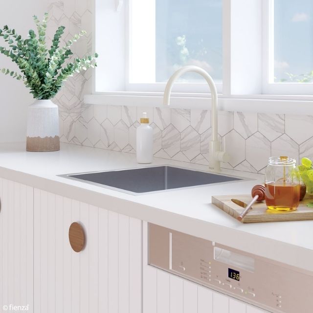 Fienza Hana single bowl stainless steel sink in white benchtop kitchen, with gooseneck mixer tap