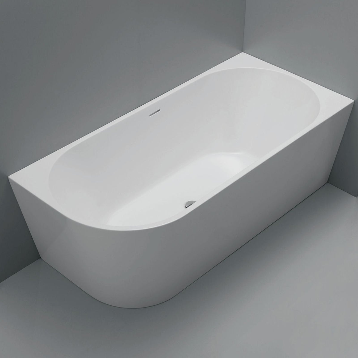 Fienza Isabella left hand corner bath in matte white acrylic, oval shape with overflow, shown installed in a grey corner setting
