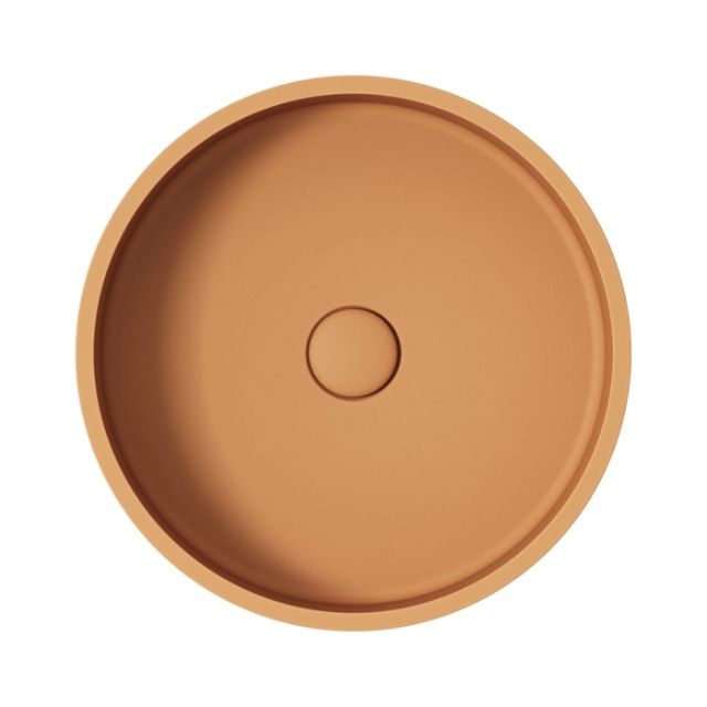 Fienza Jada round above-counter basin in Tuscan concrete, shown from above with a central waste hole
