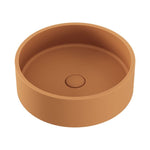 Fienza Jada round above-counter basin in Tuscan concrete, with a clean no-overflow design and centred waste opening