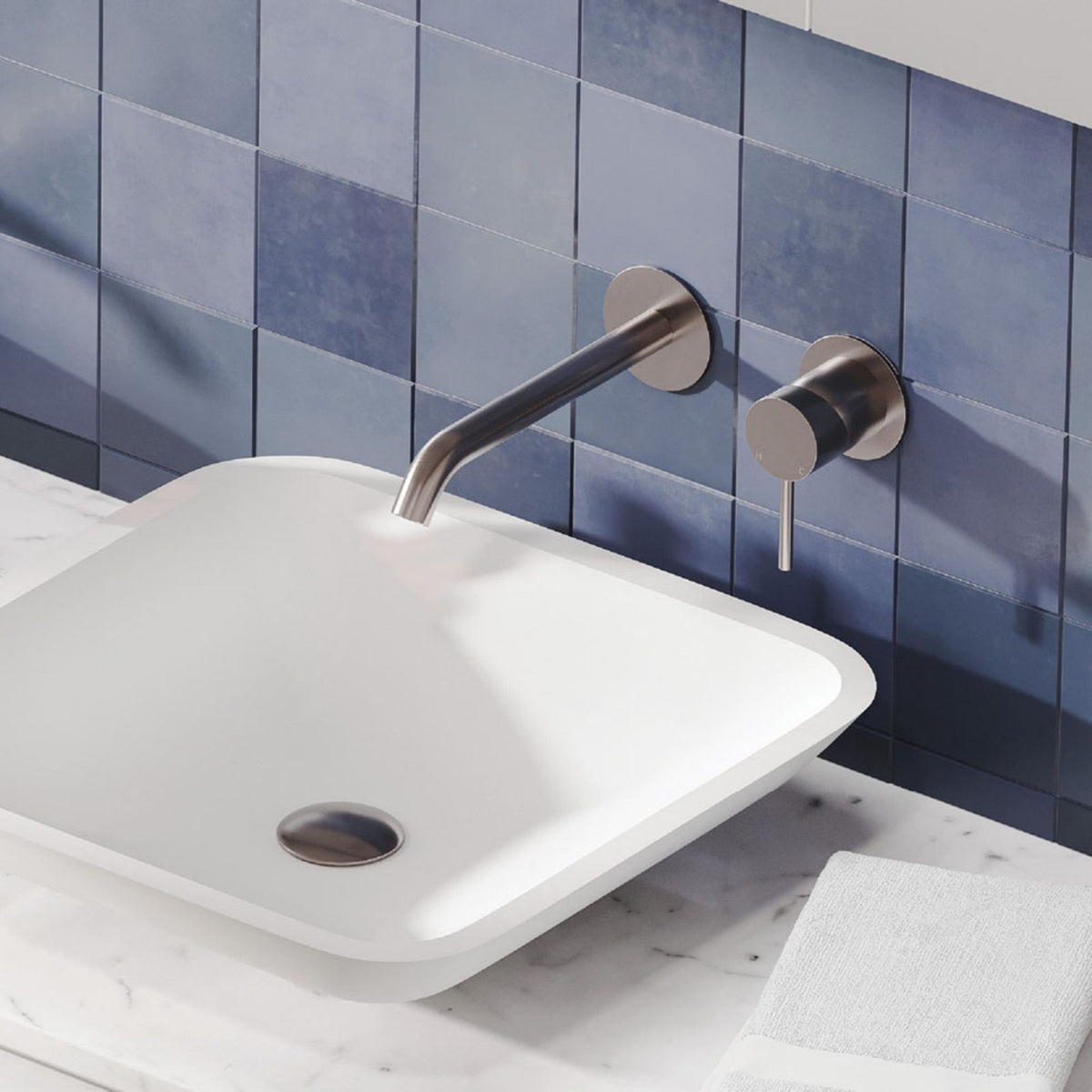 Fienza Kaya wall basin mixer set in brushed nickel with round plates and curved outlet above a white basin