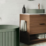 Fienza Kaya dual purpose towel rail in brushed copper, mounted on a bathroom vanity with a hand towel draped over it