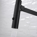Fienza Kaya pull down sink mixer in matte black with water flowing from the detachable spray head