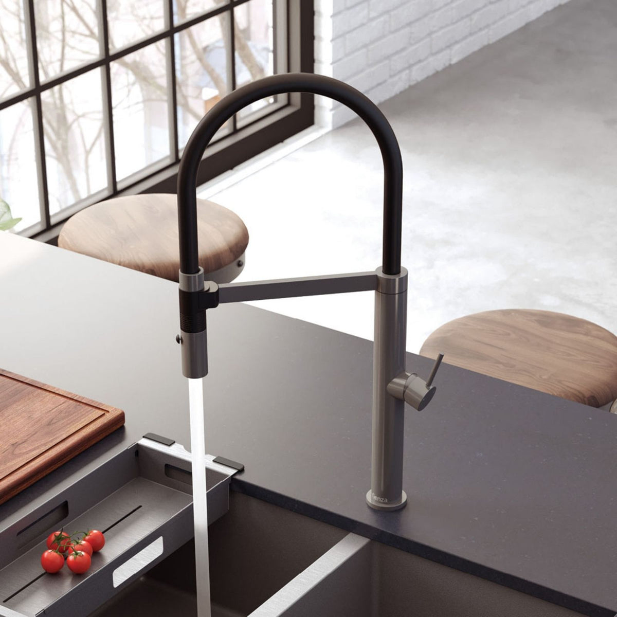 Fienza Kaya pull down sink mixer in gun metal, shown over a kitchen sink with flowing water and side lever control
