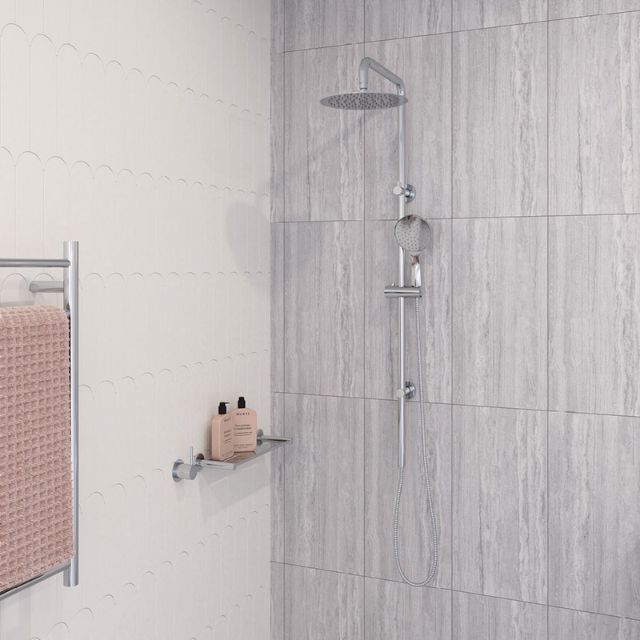 Fienza Kaya twin rail shower in chrome, with overhead shower and handheld on a rail in a modern tiled bathroom
