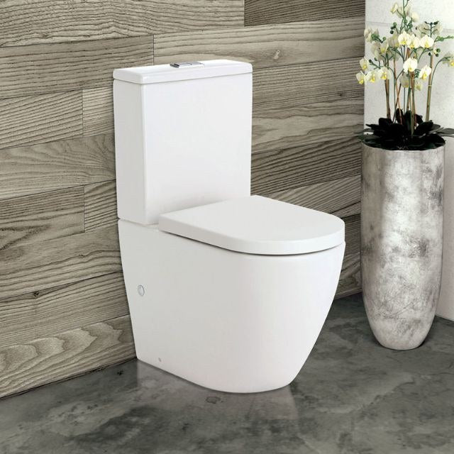Fienza Koko gloss white back-to-wall toilet suite with cistern and soft close seat, shown in bathroom setting