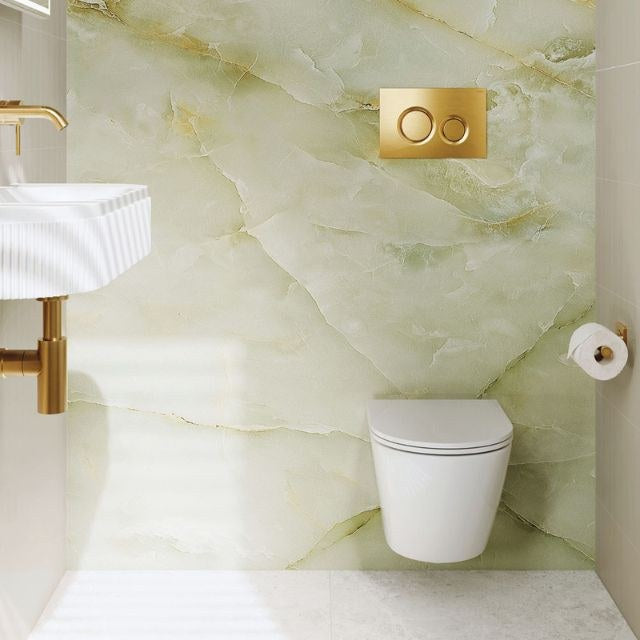 Fienza Koko wall hung toilet suite in matte white, shown in a bathroom setting with slim seat and in-wall cistern plate