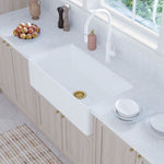 Fienza Olivia large white fire clay butler sink with flat front, installed in a bright kitchen bench top