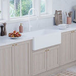 Fienza Olivia large reversible butler sink in gloss white, shown installed in a light timber kitchen countertop