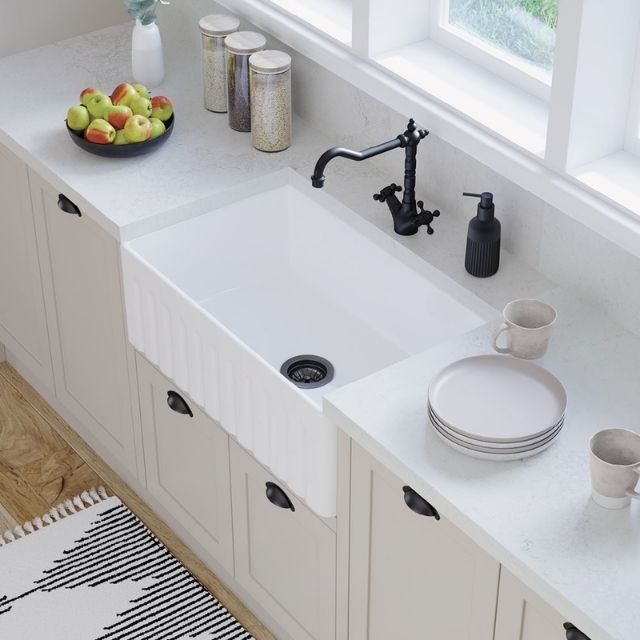 Fienza Olivia gloss white butler kitchen sink with fluted front in a light, modern kitchen bench setting