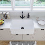 Fienza Olivia butler sink in gloss white, fluted-front apron sink shown in a bright kitchen with black tapware