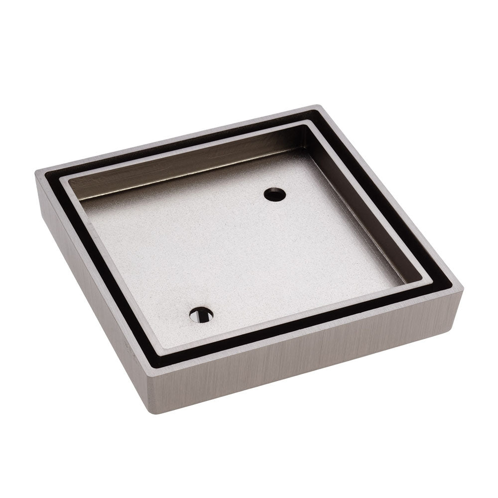 Fienza square tile insert floor waste in brushed nickel, shown in angled view with square brass drain grate.