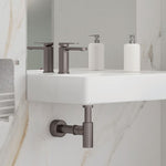 Fienza Tono basin mixer in gun metal, hob mounted beside a white vanity in a modern bathroom setting