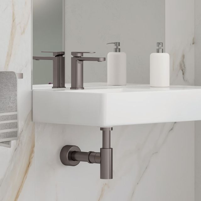 Fienza Tono basin mixer in gun metal, hob mounted beside a white vanity in a modern bathroom setting