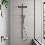 Fienza Tono twin rail shower in gun metal, with overhead and handheld shower mounted on a wall in a tiled bathroom