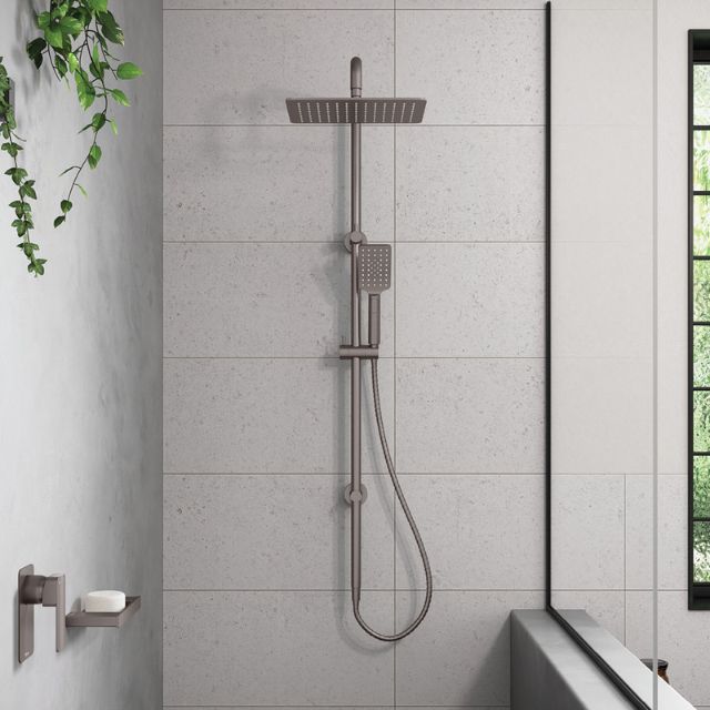 Fienza Tono twin rail shower in gun metal, with overhead and handheld shower mounted on a wall in a tiled bathroom