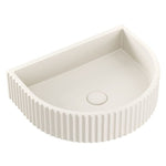 Fienza Valentina warm white concrete wall basin with fluted arch front, shown from above on white background