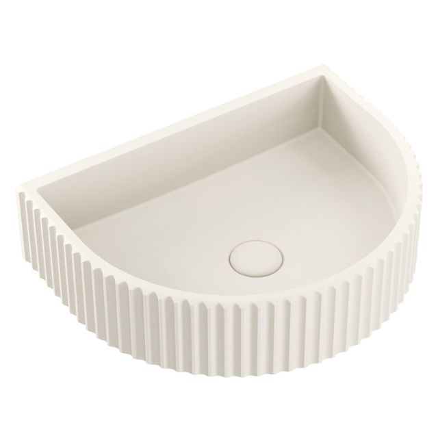 Fienza Valentina warm white concrete wall basin with fluted arch front, shown from above on white background