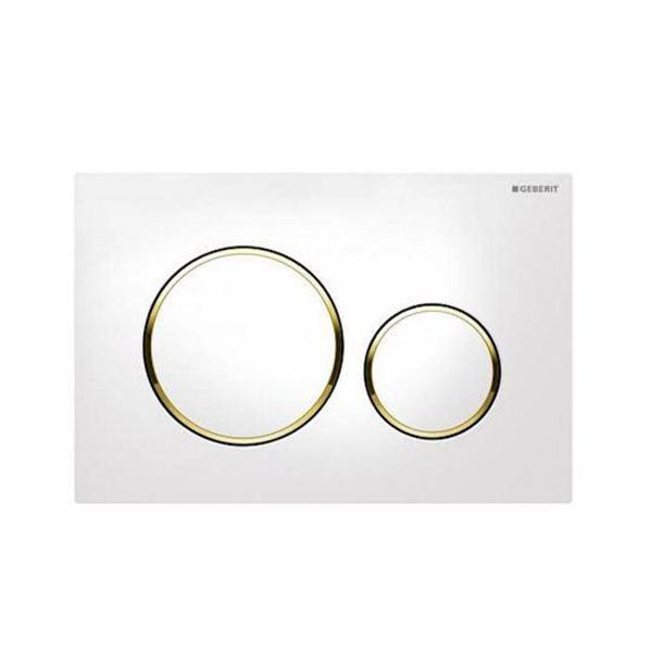 Geberit Sigma 20 dual flush plate in white with gold trim, with two circular buttons on a square wall plate