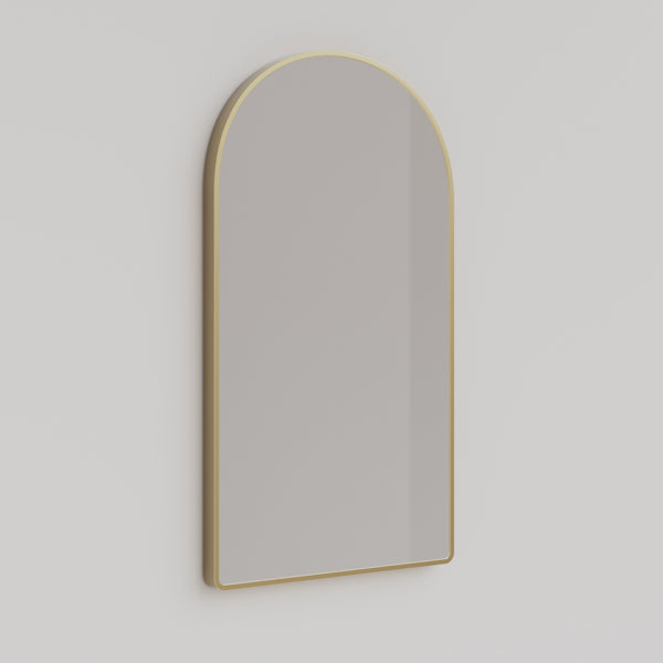 Ingrain arch wall mirror with brushed gold frame above a bathroom vanity, portrait view