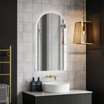 Ingrain arch frameless backlit LED mirror above vanity, portrait wall-mounted with soft glow