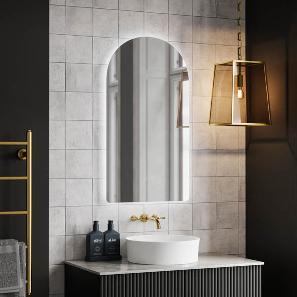 Ingrain arch frameless backlit LED mirror above vanity, portrait wall-mounted with soft glow