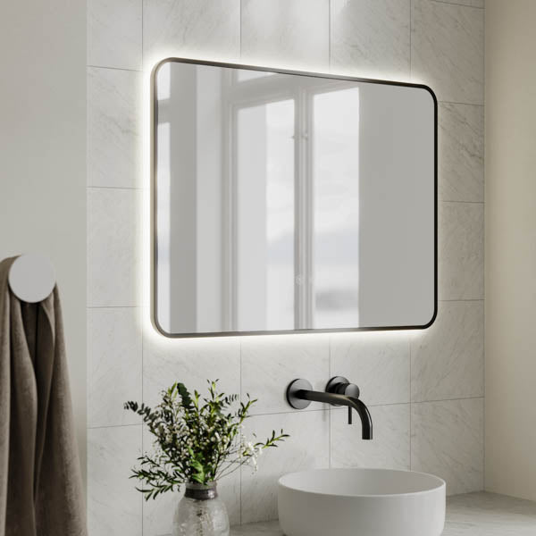 Ingrain rectangular matte black framed backlit LED mirror in a bathroom, landscape wall-hung above a vanity basin