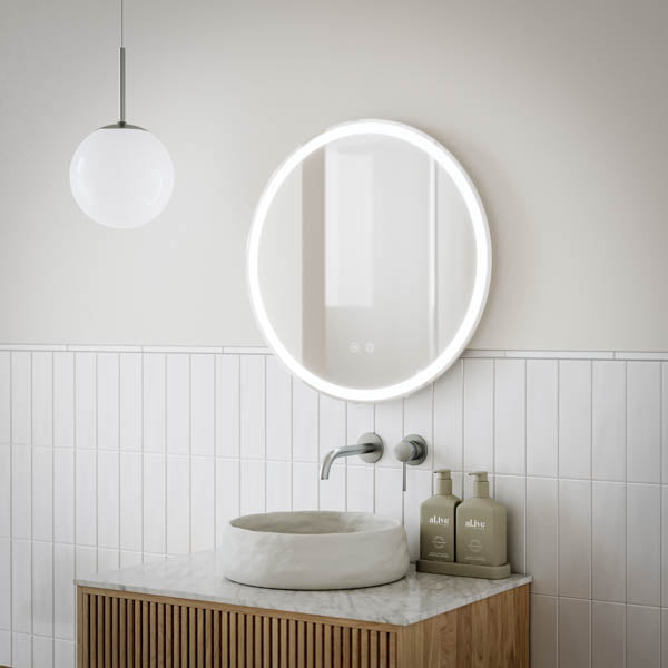 Ingrain round frameless frontlit LED mirror above a bathroom vanity with basin and wall tapware