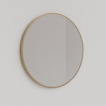 Ingrain round brushed gold framed mirror above a bathroom vanity, 800mm, wall hung